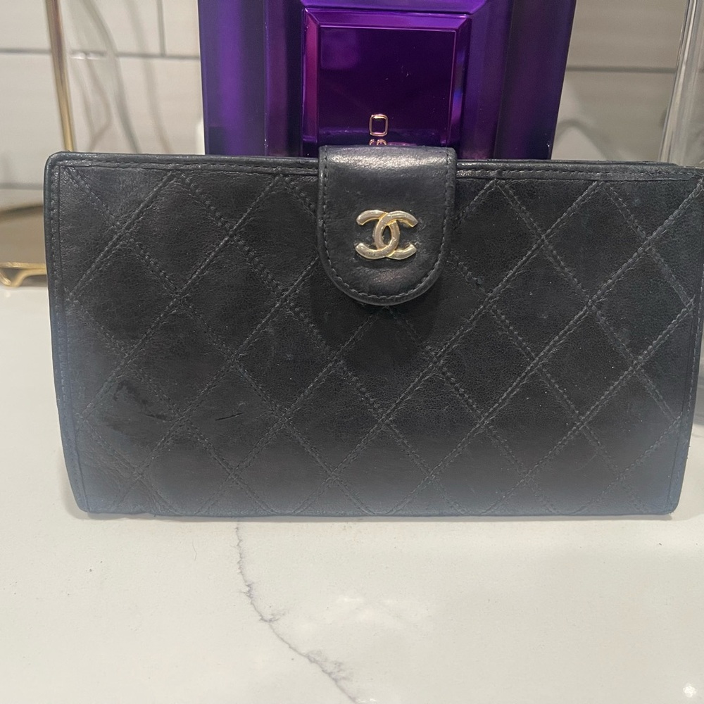 CHANEL Black Wallet with Quilted Pattern and Gold-Toned Logo